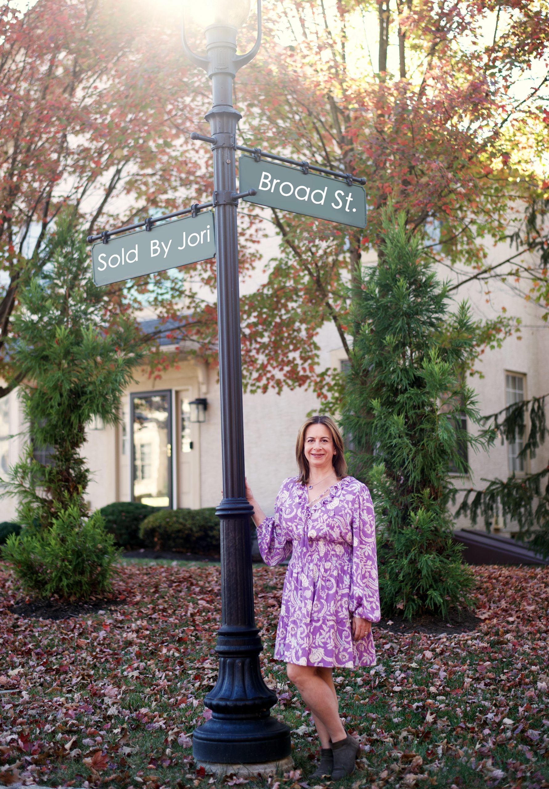 Casual shot of Jori Broad standing by a street sign