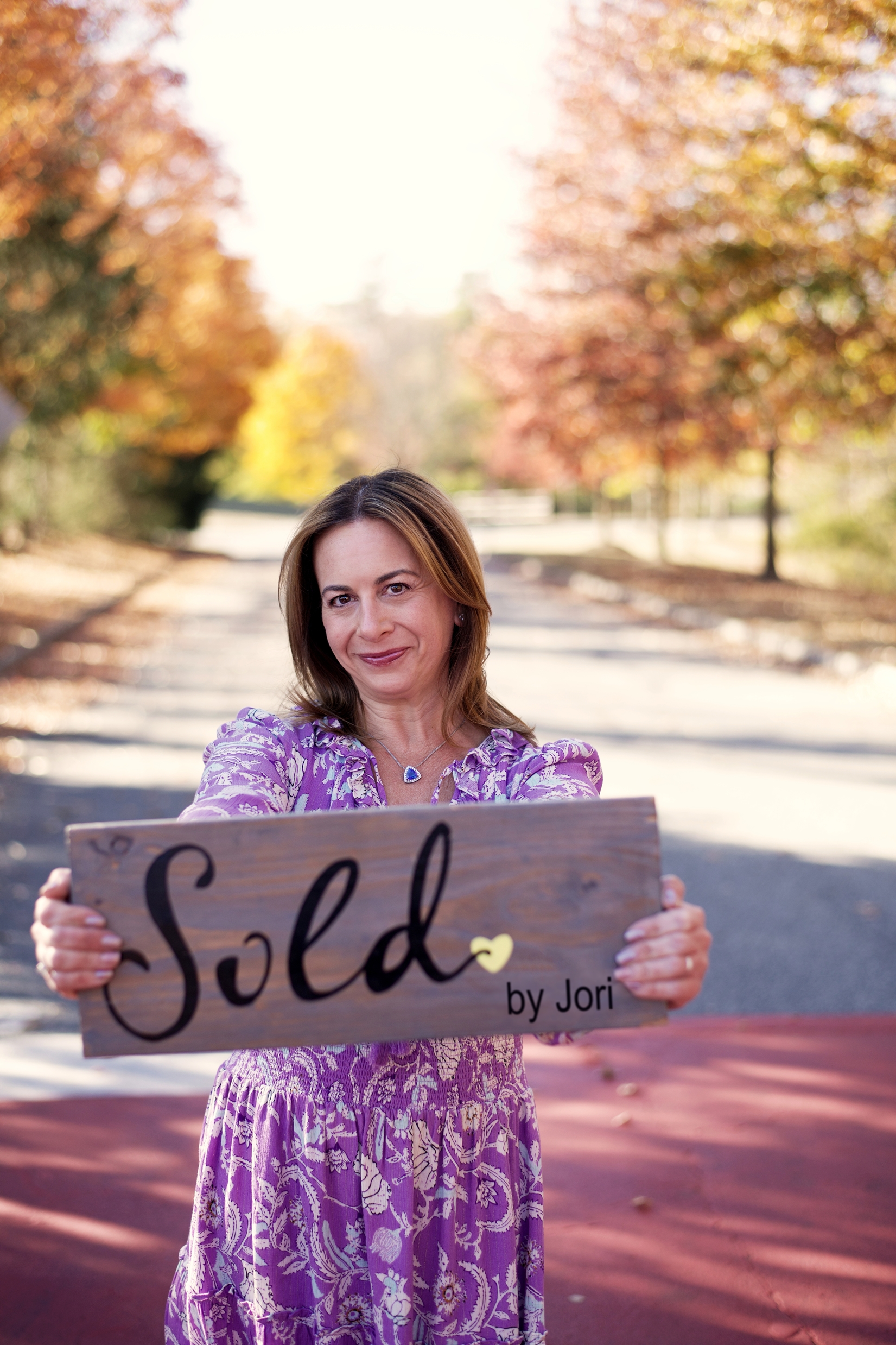 Jori Broad holding sold by Jori Sign
